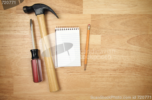 Image of Pad of Paper, Pencil, Hammer and Screwdriver