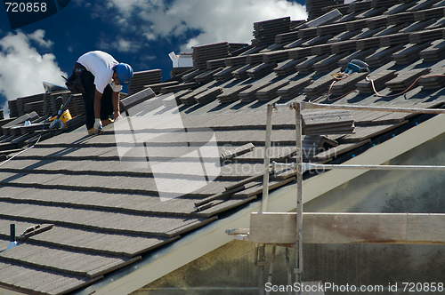 Image of Roofer Laying Tile