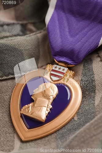 Image of Purple Heart War Medal on Camouflage Material