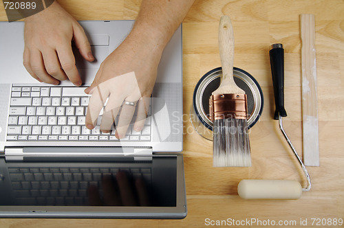 Image of Handyman Using Laptop