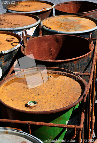 Image of Old rusty waste barrels