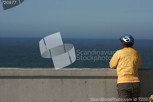 Image of Bicyclist Rests Near Ocean