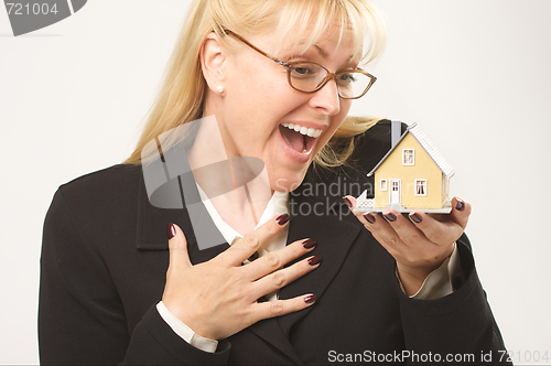 Image of Excited Female Holding House