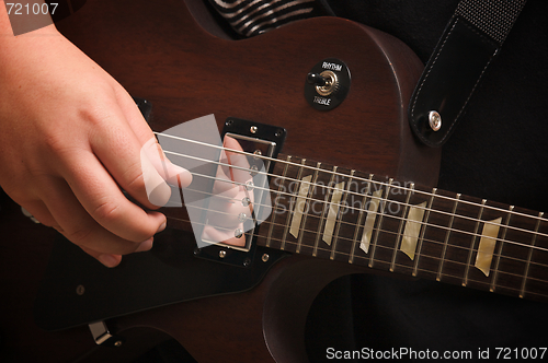 Image of Musician Plays His Gibson