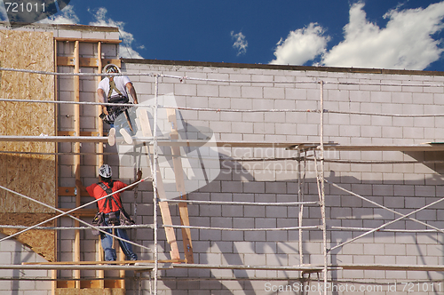 Image of Carpenters Working Diligently