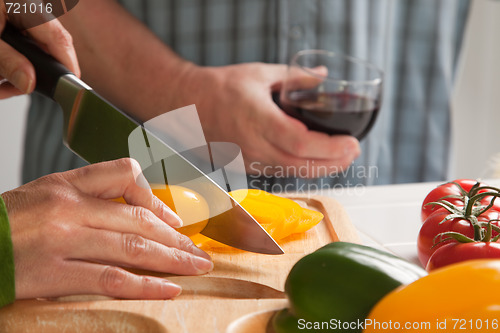 Image of Woman Slicing Vegetables on Cutting Board