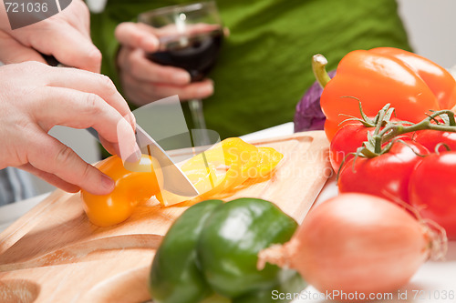 Image of Man Slicing Vegetables