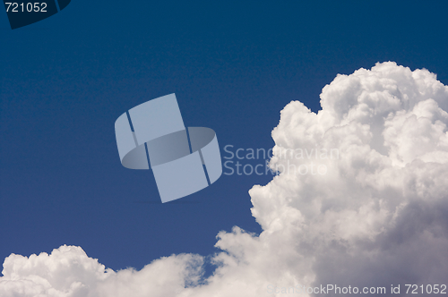 Image of Puffy Clouds on a blue sky.