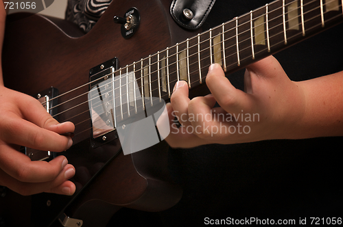 Image of Musician Plays His Gibson