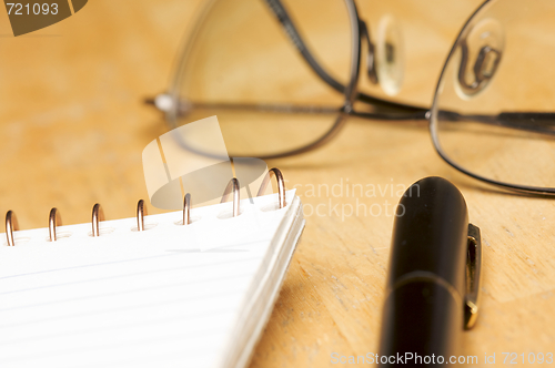 Image of Pen, Pad and Glasses Abstract