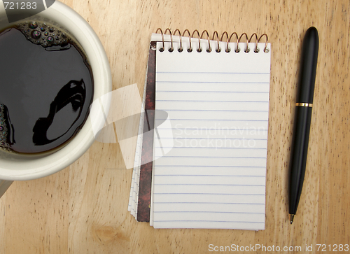 Image of Note Pad Cup and Pen on Wood