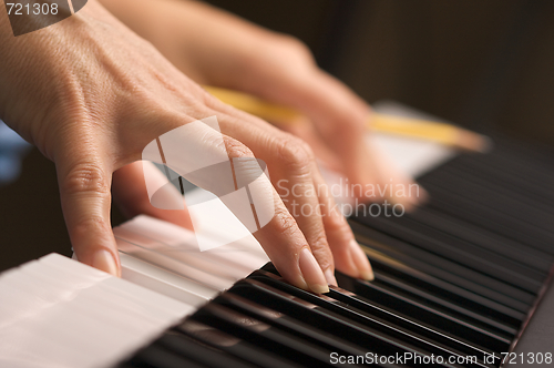 Image of Woman's Fingers on Digital Piano Keys