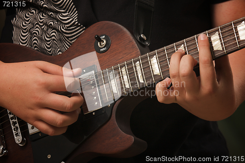 Image of Musician Plays His Gibson