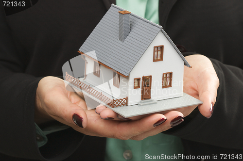 Image of House in Female Hands