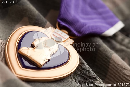Image of Purple Heart War Medal on Camouflage Material