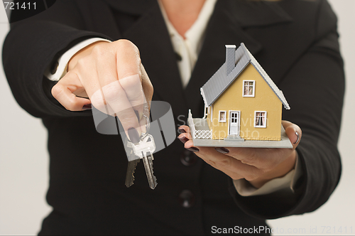 Image of House and Keys in Female Hands