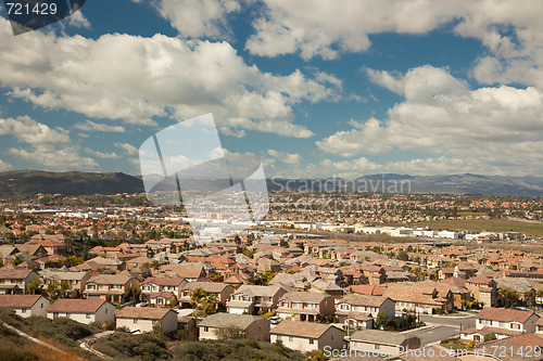 Image of Contemporary Neighborhood and Majestic Clouds