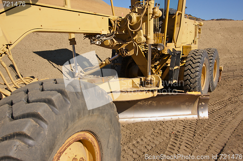 Image of Tractor at a Construction Site and dirt lot.