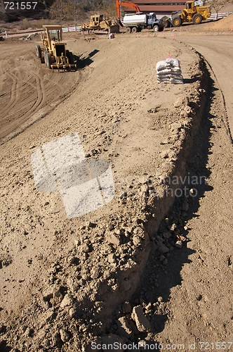 Image of Sandbags & Machinery at Construction Site