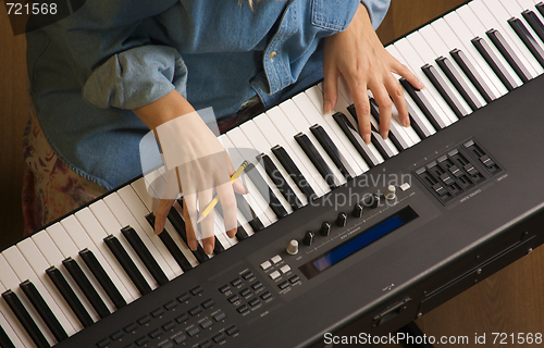 Image of Woman's Fingers on Digital Piano Keys