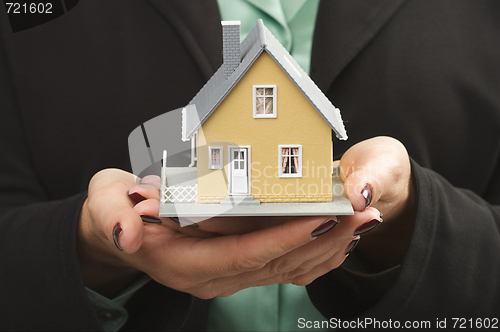 Image of House in Female Hands