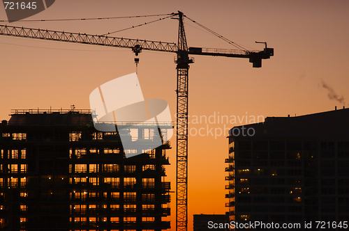 Image of Silhouette of Crane and Building