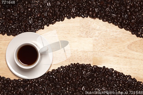 Image of Dark Roasted Coffee Beans and Cup on Wood Background