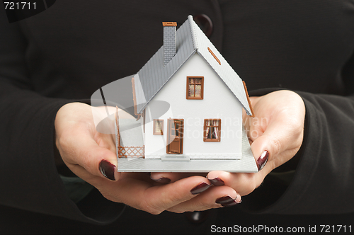 Image of House in Female Hands