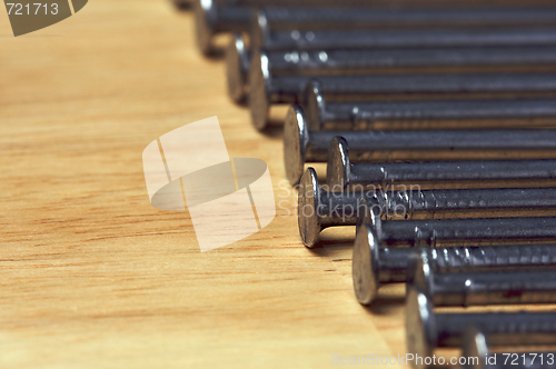 Image of Macro of Nails on Wood