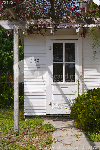 Image of Abstract front door image of old house.

