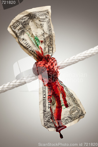 Image of Wrinkled American Dollar Bleeding in Rope