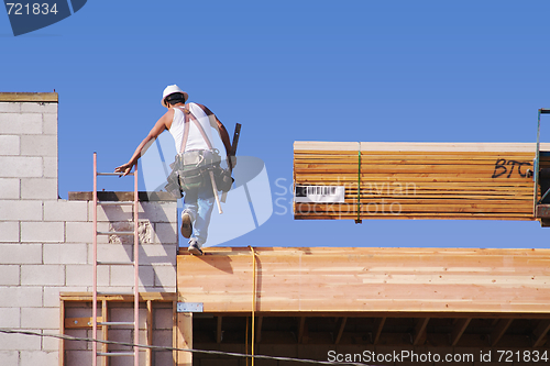 Image of Carpenter Climbing Up Ladder