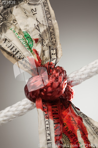 Image of Wrinkled American Dollar Bleeding in Rope