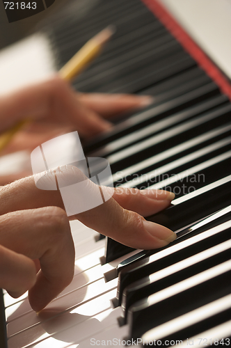 Image of Woman's Fingers on Digital Piano Keys