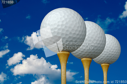 Image of Three Golf Balls & Tees