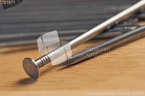 Image of Macro of Nails on Wood