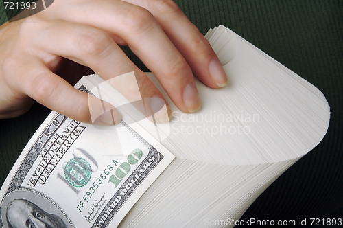 Image of Woman fanning Large Stack of One Hundred Dollar Dollar Bills