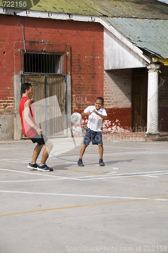 Image of editorial native nicaragu boys play soccer on sports concrete fi