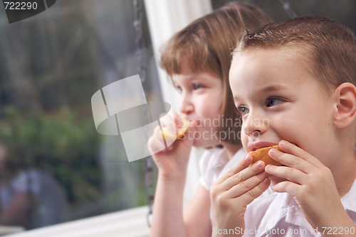 Image of Sister and Brother Eating an Apple