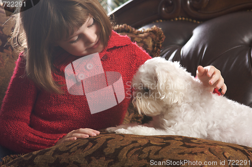 Image of Young Girl with Her Maltese Puppy