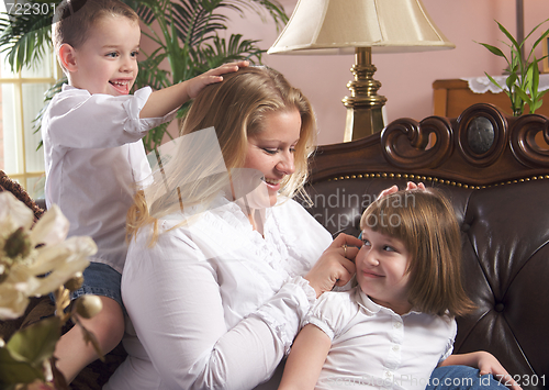 Image of Mother and Children on The Couch