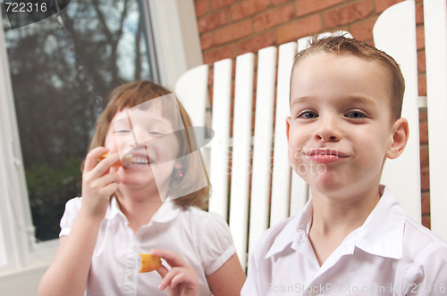 Image of Sister and Brother Eating an Apple