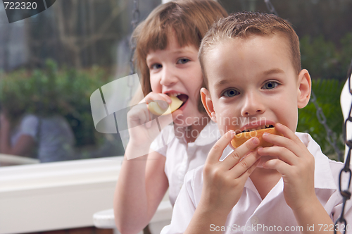 Image of Sister and Brother Eating an Apple