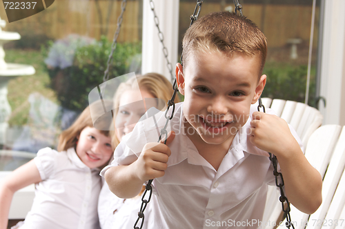 Image of Young Boy Poses with Mom and Sister