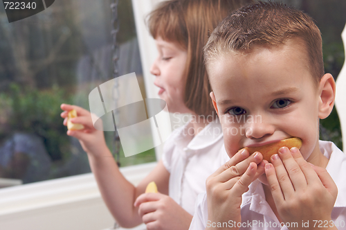Image of Sister and Brother Eating an Apple