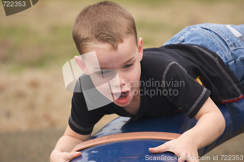 Image of Adorable Child Playing at the Playground