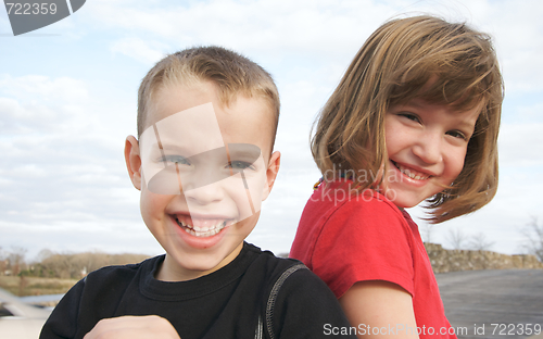 Image of Two Children Smile for the Camera