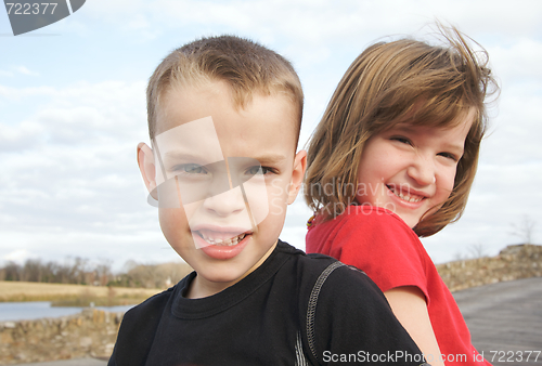 Image of Two Children Smile for the Camera