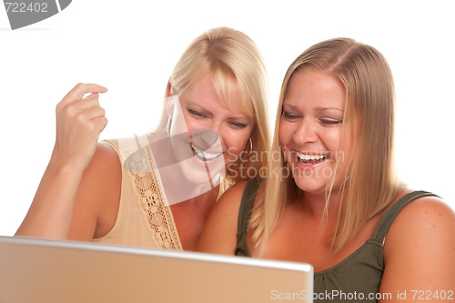 Image of Two Laughing Women Using Laptop