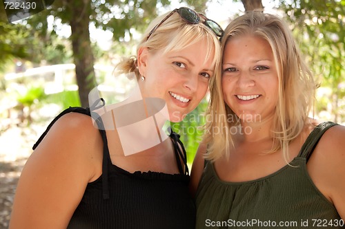 Image of Two Beautiful Smiling Sisters Ourdoor Portrait